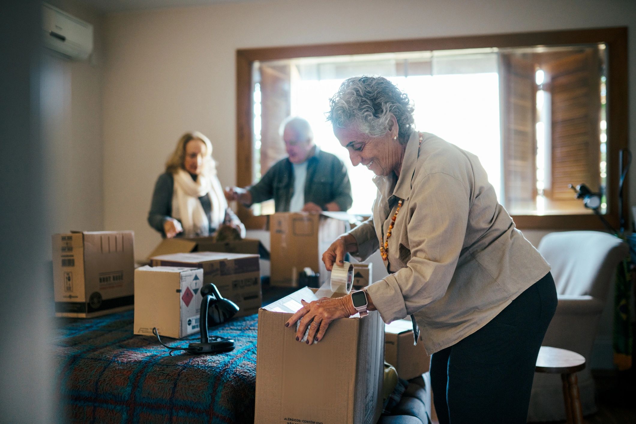 People unpacking boxes after a move