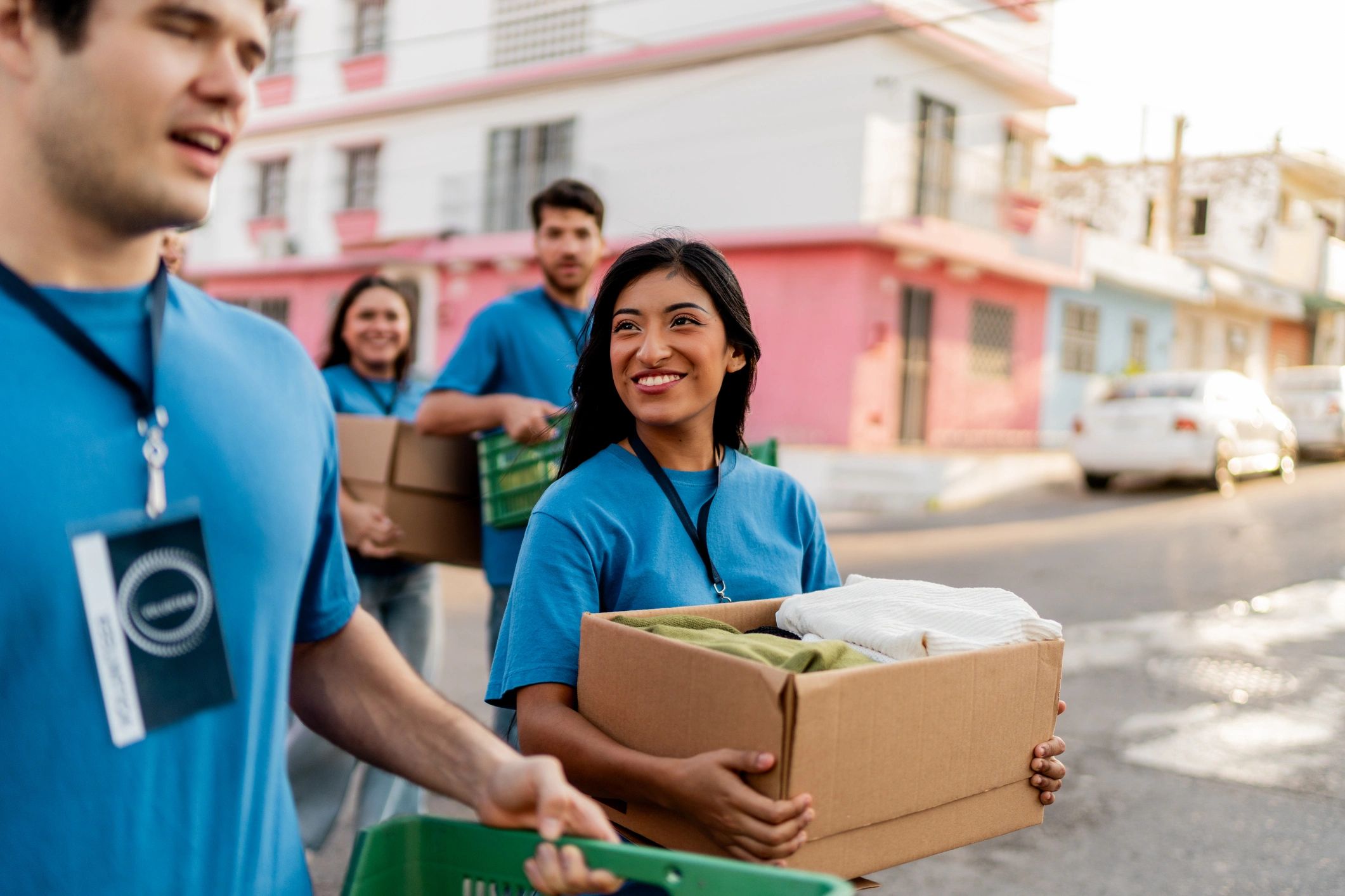 Moving team handling boxes outdoors